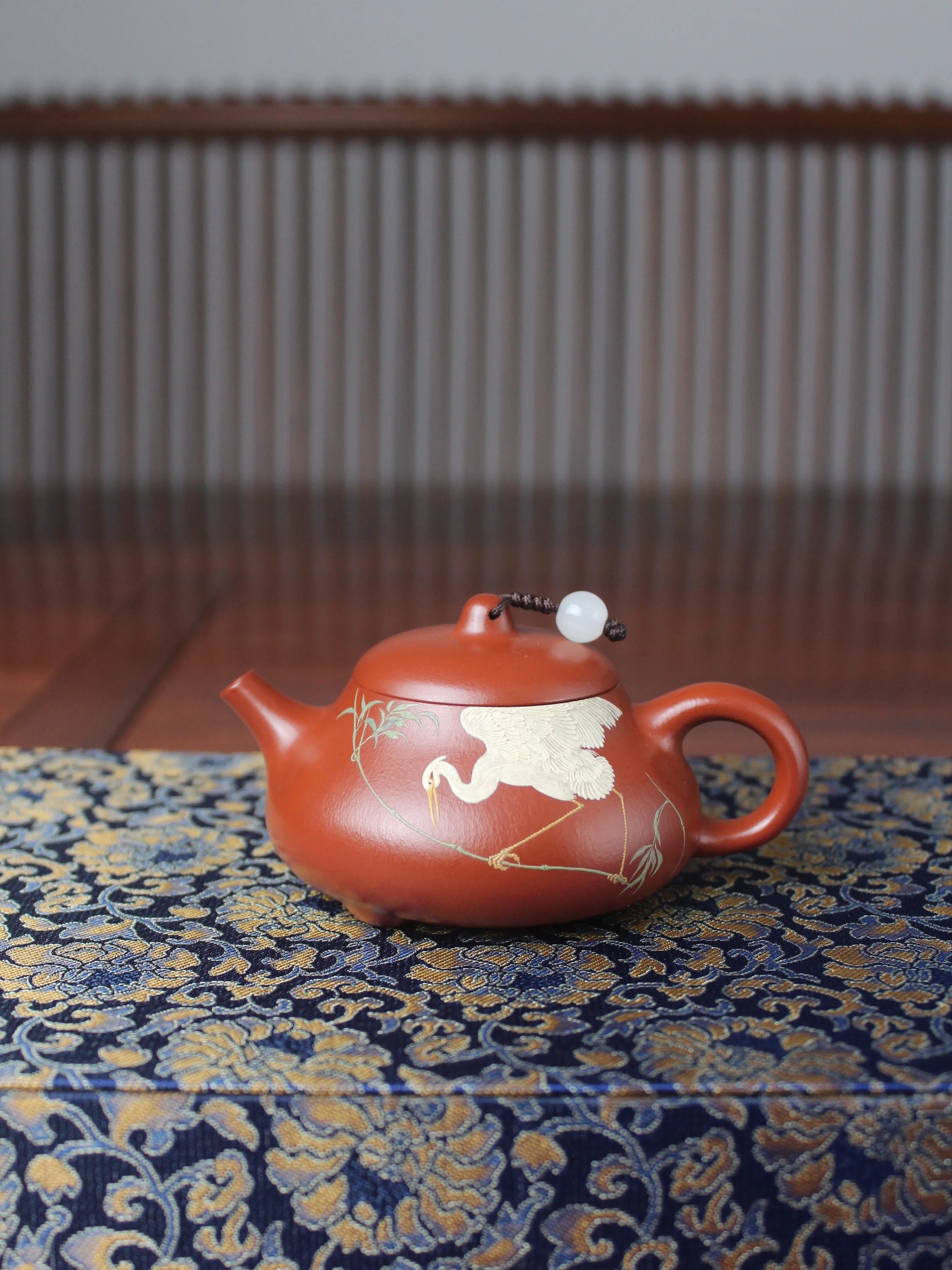 An artwork teapot named "Egret" created by teapot artist